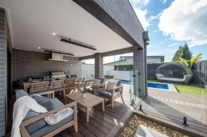 Casa de Praia luxe retreat with heated pool, walk to beach and golf